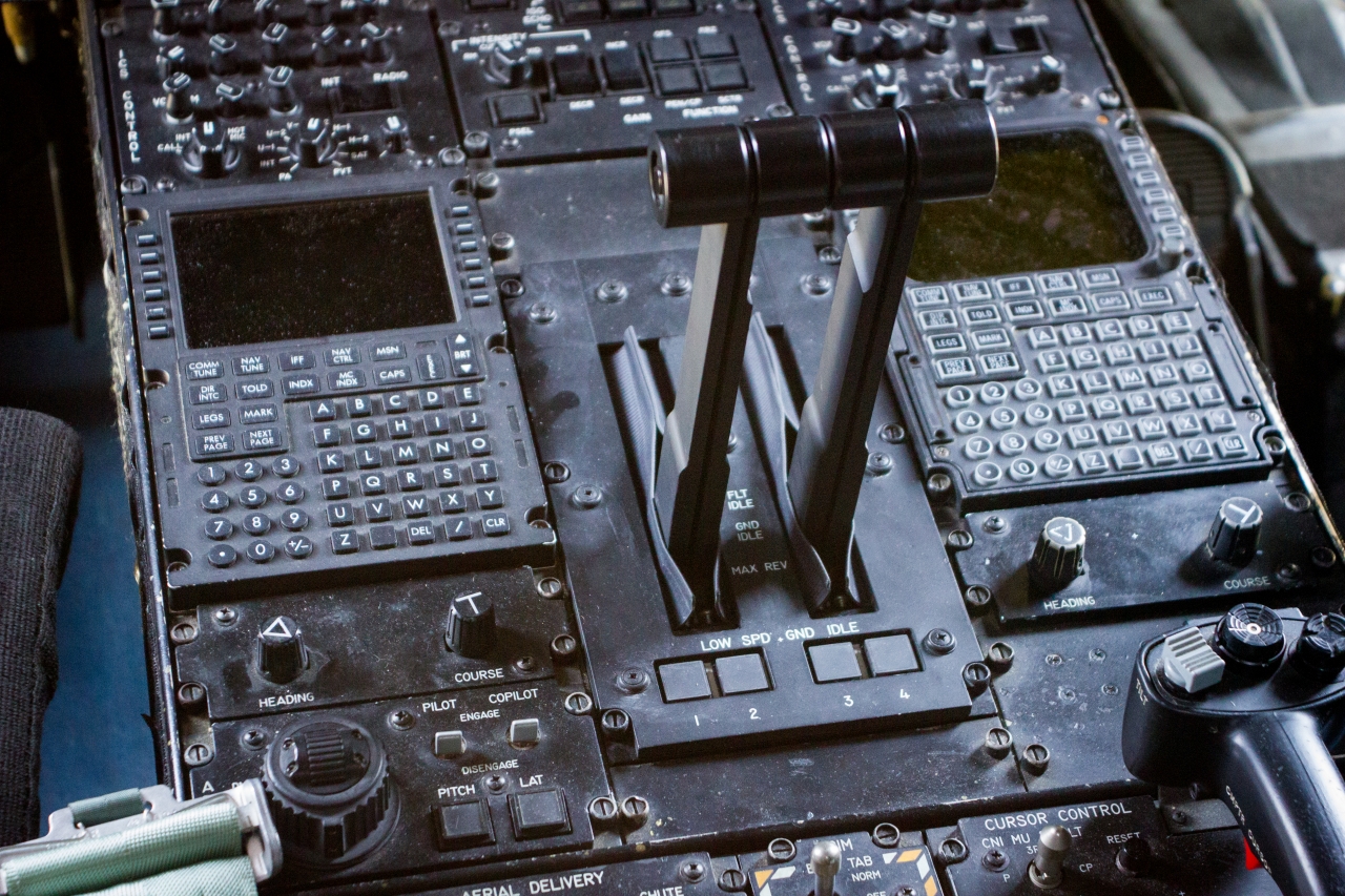 Engine throttle, navigational system input panels and other controls on the cockpit pedestal aboard United States Air Force Reserve 403d Wing 53d Weather Reconnaissance Squadron 'Hurricane Hunters' WC-130J Hercules 75304.