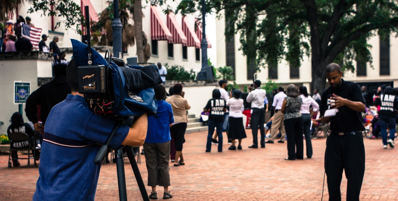 A reporter and his cameraman prepare to film a report during the post-march rally for Trayvon Martin on the western steps of the Old Capitol (1845) on the forty-fourth anniversary of Dr. Martin Luther King, Jr.'s assassination.