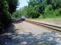 CSX hyrail truck stopped on the Seaboard Coast CSX Railroad Line near Myers Park.