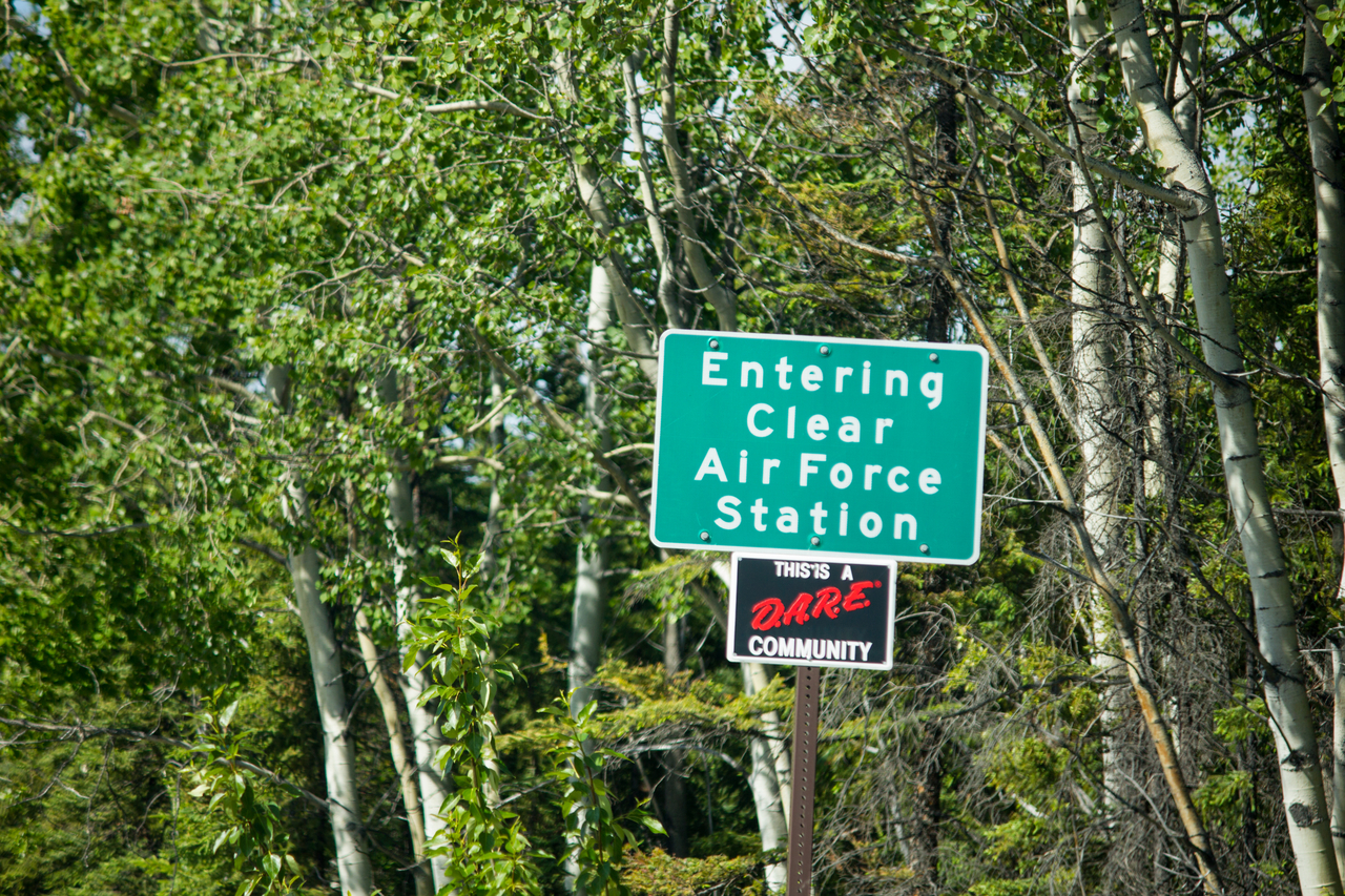 "Entering Clear Air Force Station" sign on the public road to the base.