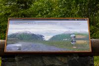 Educational sign from the National Park Service and U.S. Forest Service about Exit Glacier at a turnout to its east.