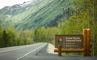 Kenai Fjords National Park entrance sign on the road to Exit Glacier.