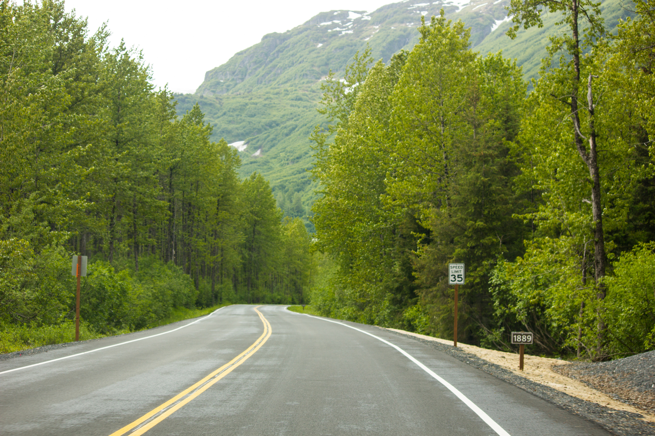 Year signs along the road show the previous extent of the receding Exit Glacier.