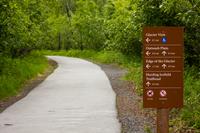 Directional sign at the start of the trail system behind the Exit Glacier Nature Center.