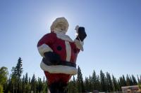 A forty-two-foot tall, 900-pound fiberglass Santa Claus statue (1968) by Wes Stanley of Stanley Plastics, Enumclaw, Washington on display near the Santa Claus House (1952).