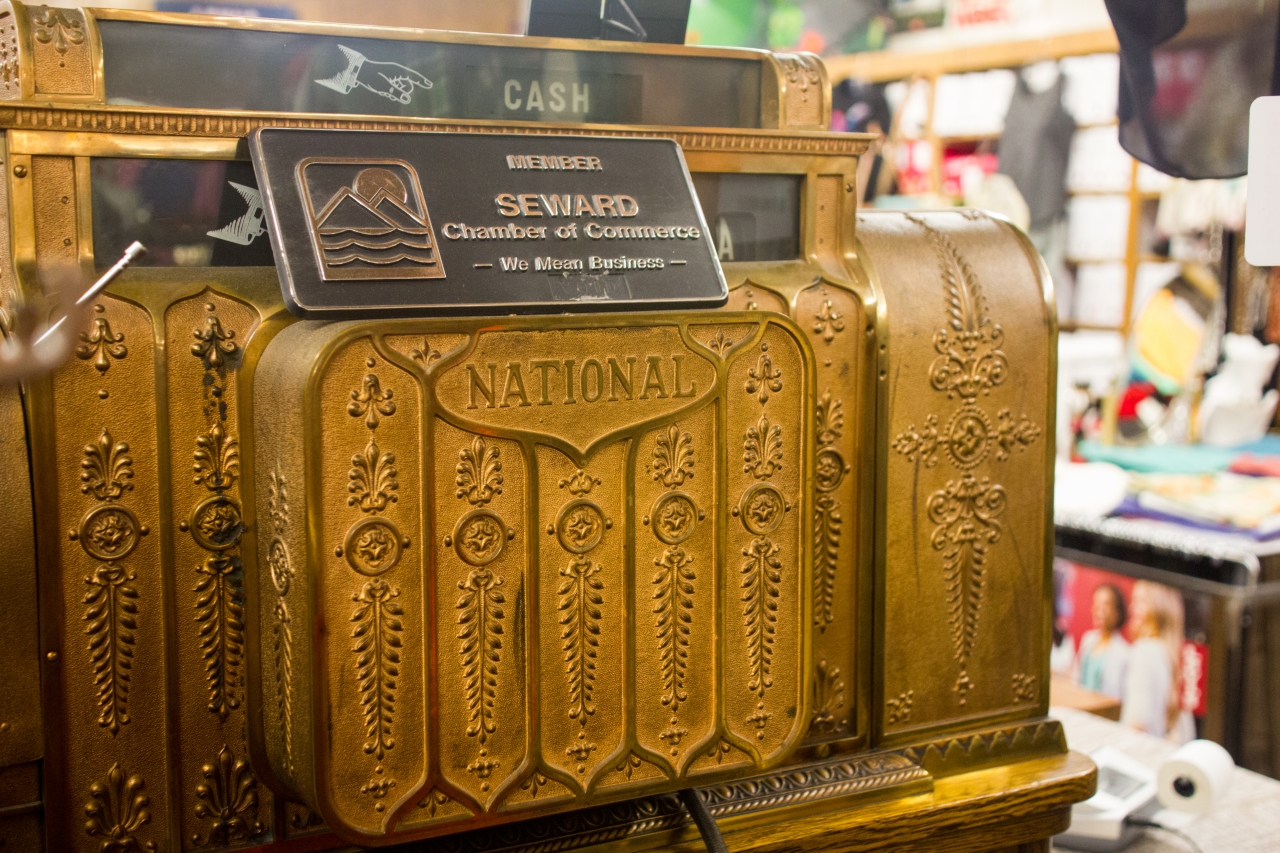 Back of the vintage National Cash Register Company brass register (1908) with fifty-four keys and two drawers still in use at Urbach's Clothiers.