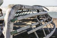 The wooden frame of an umiak, an Iñupiat seal skin whaling boat, along the shore of the icy Chukchi Sea, Arctic Ocean.