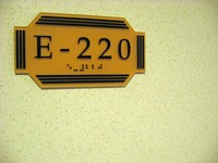 'E-220' door sign, seen in the corridor outside Cabin E-220, Deck 7 port aft on Carnival Sensation.