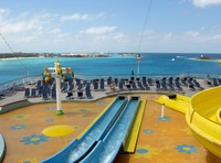 Carnival WaterWorks Twister water slide and park and the blue waters of Nassau Harbour beyond, seen from the Deck 12 aft lookout on Carnival Sensation.