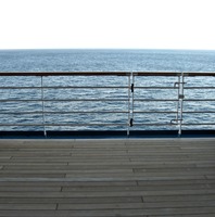 The Atlantic Ocean and railing along the Deck 10 starboard exterior corridor on Carnival Sensation.