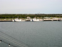 NASA Solid Rocket Booster recovery ships MV Liberty Star IMO 7925302 and MV Freedom Star IMO 7925314 docked at Poseidon Wharf, Cape Canaveral Air Station, seen from the Deck 11 forward lookout above the bridge on Carnival Sensation.