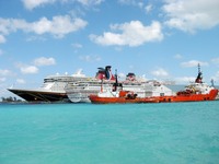 Disney Dream IMO 9434254, Carnival Sensation and tugboats Suhaili IMO 7626592 and Bluster IMO 8516976 docked at Prince George Wharf, Port of Nassau.