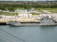 US Army landing ship USAV El Caney LCU 2017 docked at Poseidon Wharf, Cape Canaveral Air Station, seen from the Deck 11 forward lookout above the bridge on Carnival Sensation.