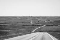 Montana Secondary Highway 464 winding south through agricultural land in the Blackfeet Indian Reservation.