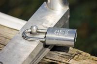 A padlock by Best Access Systems on the ladder attached to the Apgar Village boat ramp dock on Lake McDonald in Glacier National Park.