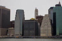 55 Water Street (1972), One Financial Square (1987), 111 Wall Street (1966), 120 Wall Street (1930) and Continental Center (1983) along the East River in Manhattan's Financial District from the southwest corner of Brooklyn Bridge Park (2010) Pier 1.