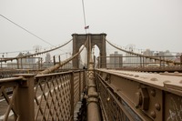 Four main cables leading up to the western side of the eastern tower of the Brooklyn Bridge (1883) from the pedestrian and cyclist promenade.