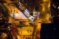 Southern closeup of the Flatiron Building (1902), snow on the ground and the intersection of 23rd Street, 5th Avenue and Broadway from the 86F observation deck of the Empire State Building (1931).
