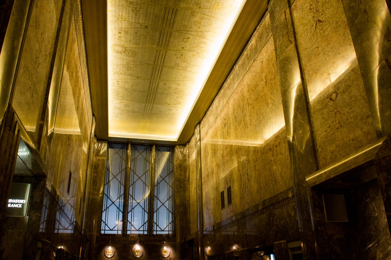 Restored marble walls and ceiling mural in the lobby of the Empire State Building (1931).