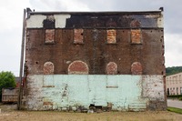 The back wall of the Titusville Moose Lodge building (1873) that abutted a two-floor KFC until Tuesday, 27 August 2013 when the latter was demolished.