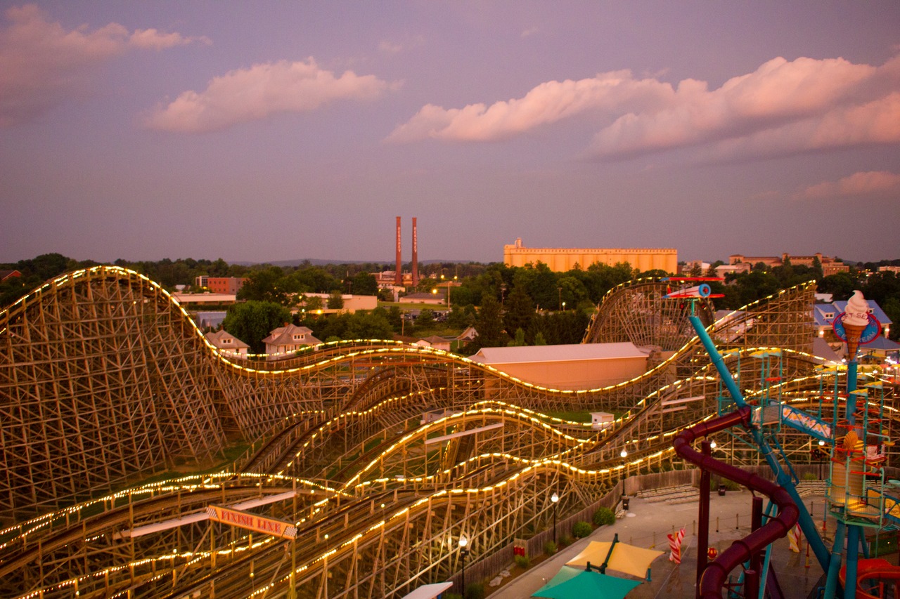 Lightning Racer (2000) wooden roller coaster and East Coast Waterworks (2007) water playground plus the twin smokestacks (1903) and cocoa bean silos (1950) of the original Hershey factory as seen from the Ferris Wheel (1997) at Hersheypark.