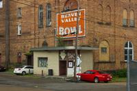 Main entrance and signs for Beaver Valley Bowl at the Beaver Valley Brewery Company Building (1903) in Rochester, Pennsylvania.