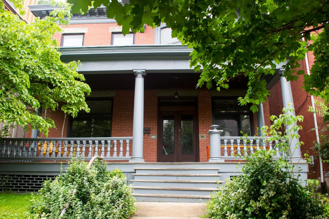 The front stairs, porch and door of the old style single family home at 359 South Atlantic Avenue (1913) in the Friendship neighborhood of Pittsburgh, Pennsylvania.