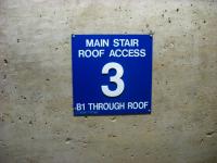Floor marker in the main stairwell seen while returning from the roof of the Sutro Tower building.