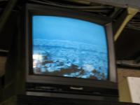 A monitor on the Sutro Tower building ground floor shows the view from a camera mounted above.