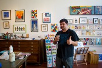 Marc Malonzo enjoys artwork and delicious beer in the 3 Fish Studios studio and gallery.