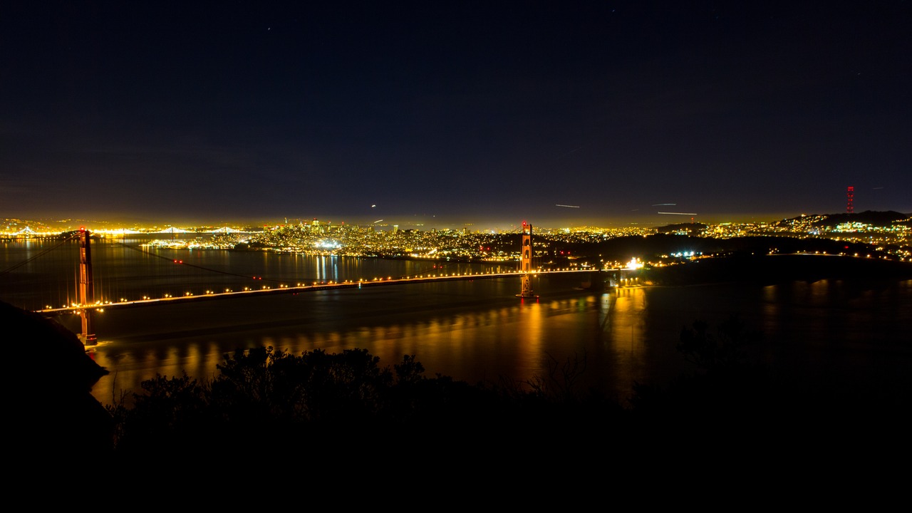 The Golden Gate Bridge and strait with San Francisco Bay, the city and Sutro Tower from near Hawk Hill in the Marin Headlands.