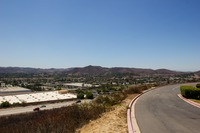 Looking southwest over Simi Valley from the water tank driveway gate the far end of the parking lot of 400 National Way (1984), the fictional PlayTronics headquarters building in 'Sneakers' (1992).