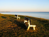 Two benches with a great view of Choctawhatchee Bay at Choctaw Beach next to Walton County Fire Rescue Station 10.