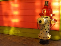 Fire hydrant painted like a fire house dalmatian at HarborWalk Village.