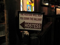'The Hostess Will Seat You Down The Hallway' sign at AJ's Seafood & Oyster Bar at HarborWalk Village.