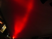 Red light illuminating the covering over the stage at HarborWalk Village (1 of 7).