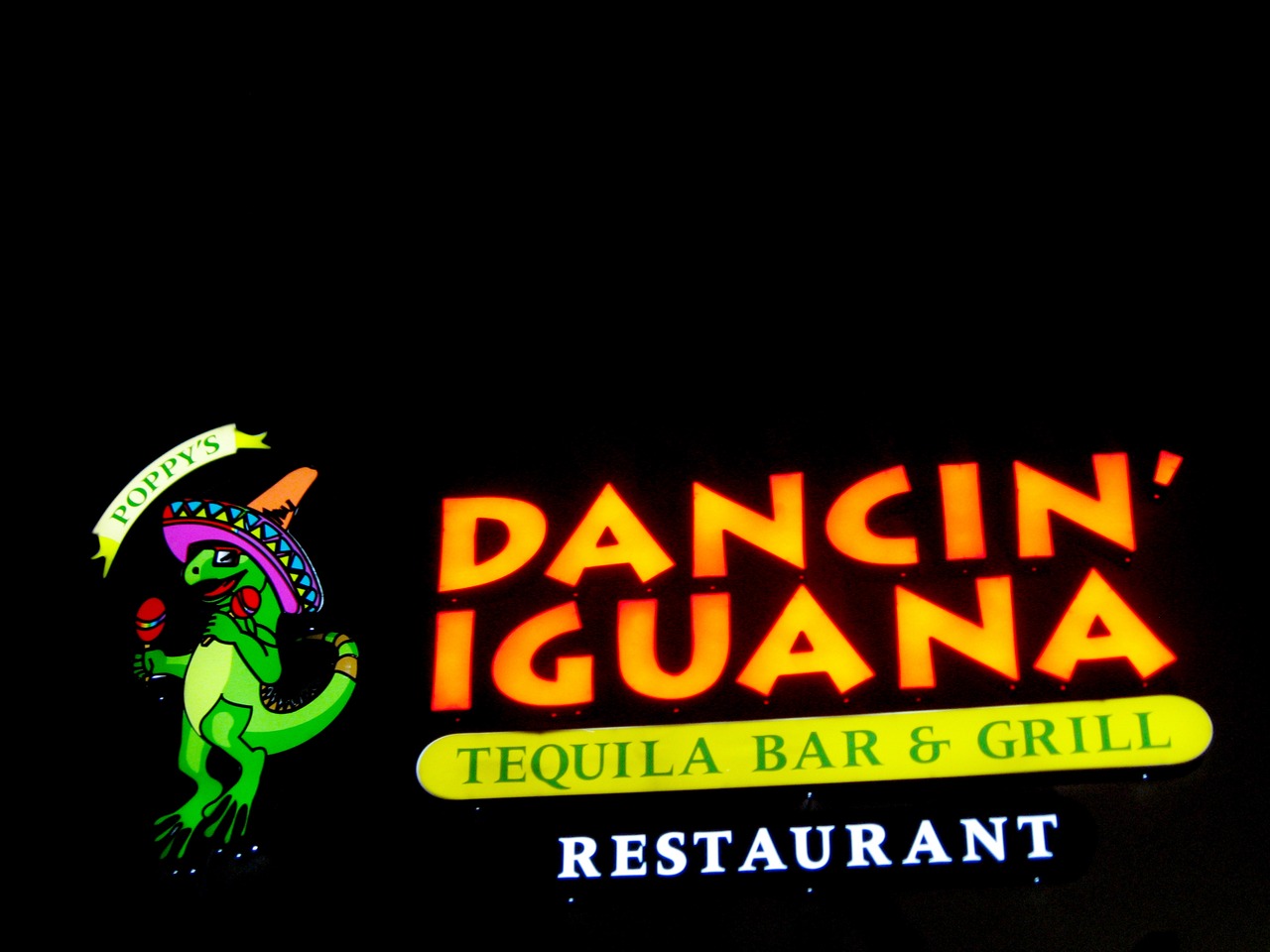 Sign for Dancin' Iguana Tequila Bar & Grill Restaurant at HarborWalk Village.