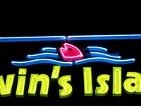 Neon sign for Alvin's Island Tropical Department Store.