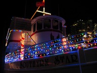 Colorful lights aboard Robbins & Sons 'Southern Star' (2001) at HarborWalk Marina next to The Lucky Snapper Grill & Bar.