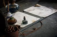 Writing instruments and a map of Florida on a desk inside the reproduction of a fort originally built here in December 1836 at what is now the Fort Foster State Historic Site at Hillsborough River State Park.
