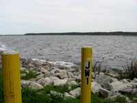 'JW1' on yellow posts next to the equipment room for the Jim Woodruff Dam (1957) on man-made Lake Seminole where the Apalachicola, Chattahoochee and Flint Rivers meet.