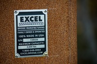 Tag for Excel Bridge Manufacturing on the new pedestrian bridge (S/N 13B028) over the CSX railroad line in Lafayette Heritage Trail Park near J.R. Alford Greenway.
