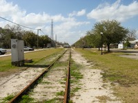 The old Savannah, Florida and Western Railroad tracks (1884) running northwest through High Springs at Main Street.