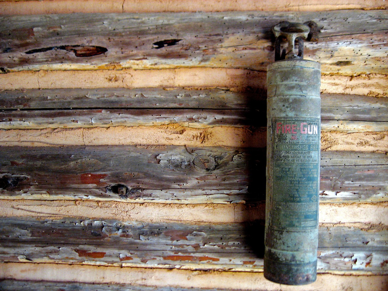 Vintage Fire-Gun No. 1 fire extinguisher by American-LaFrance Foamite Corporation of Elmira, New York in the Log Cabin School (1901) at Pebble Hill Plantation.