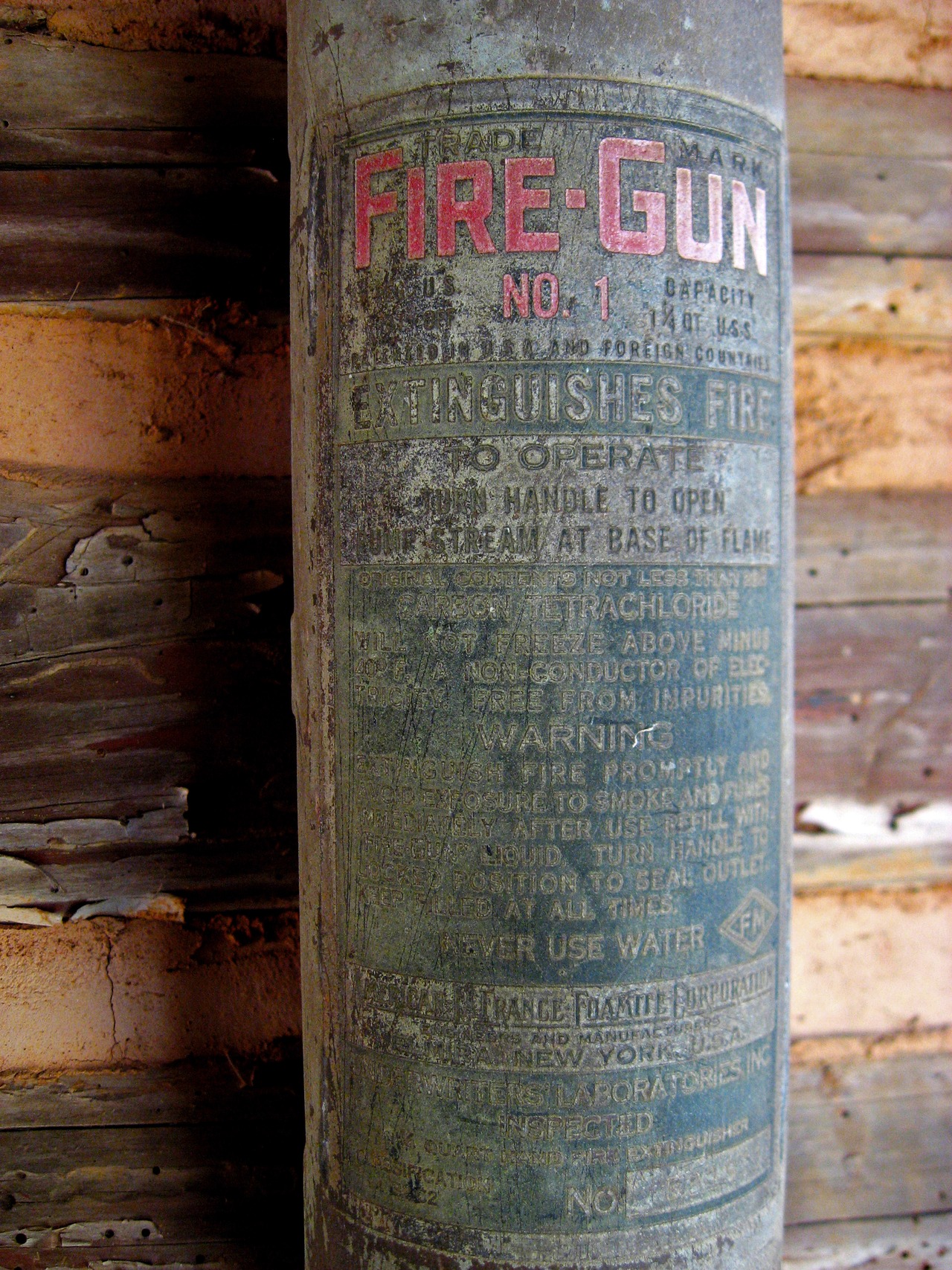 Label of the vintage Fire-Gun No. 1 fire extinguisher by American-LaFrance Foamite Corporation of Elmira, New York in the Log Cabin School (1901) at Pebble Hill Plantation.