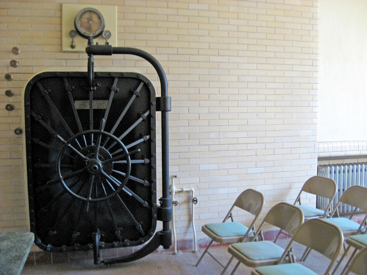 The vintage American Sterilizer Co. (AMSCO) of Erie, Pennsylvania safe-sized walk-in sterilizer in a room in the Stable Complex (1928) at Pebble Hill Plantation.