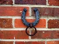 Horseshoe tie-up ring on a wall outside the Stable Complex (1928) at Pebble Hill Plantation.