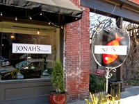 Street front signs of Jonah's Fish & Grits.