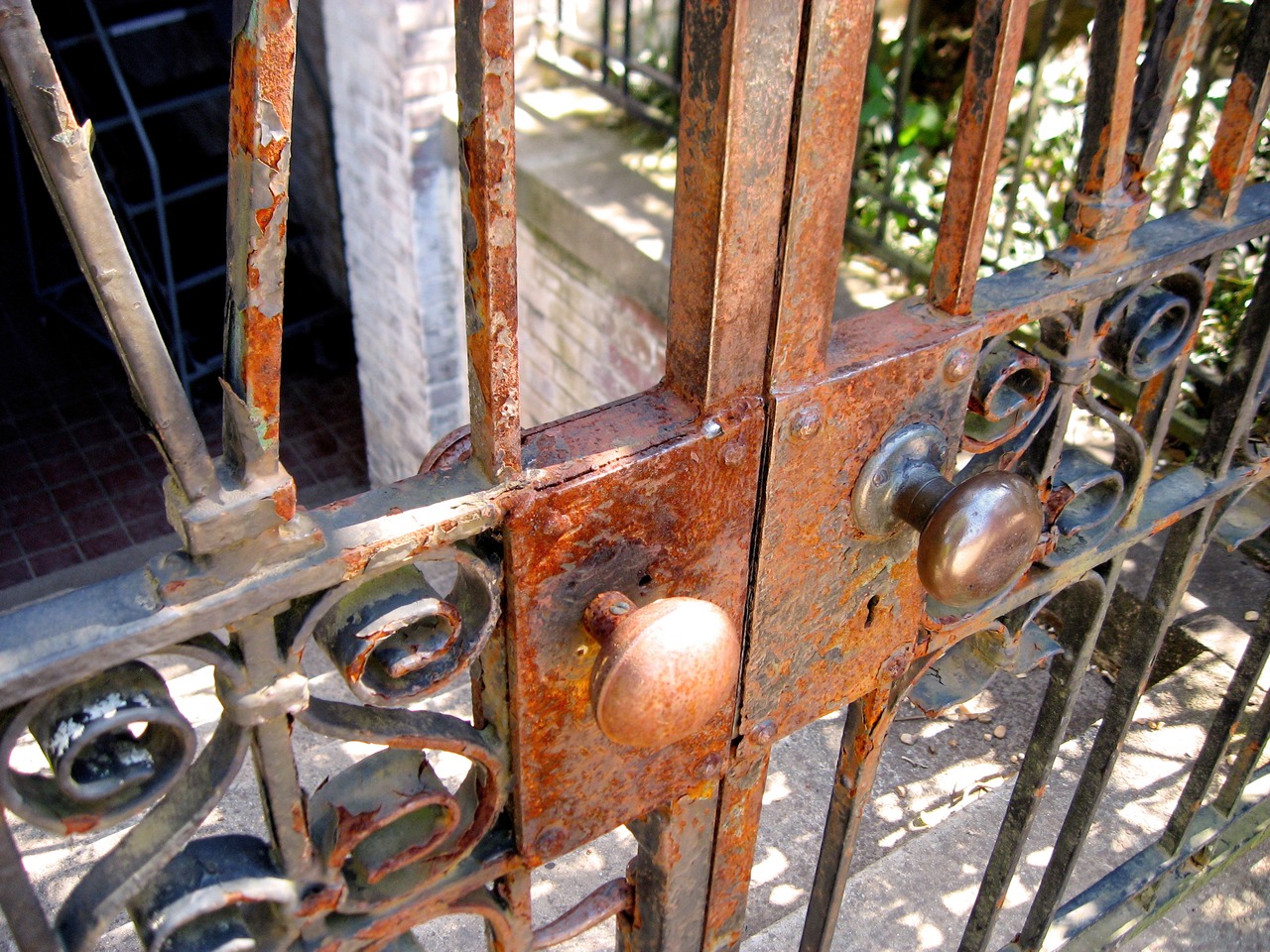Two knobs on the metal gate next to the west wing guest entrance of the main house (1936) at Pebble Hill Plantation.