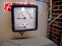 Pressure and temperature gauge by Marsh Instrument Company of Skokie, Illinois on a Heat-Pak steel boiler water heater by Aldrich Company of Wyoming, Illinois inside The Waldorf (1929) at Pebble Hill Plantation.